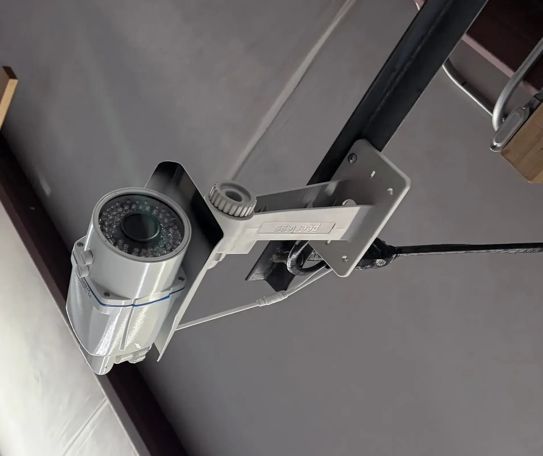 Security camera mounted overhead in the climate-controlled building, part of the facility's 24-hour video monitoring at American Mini Storage in Staunton, VA
